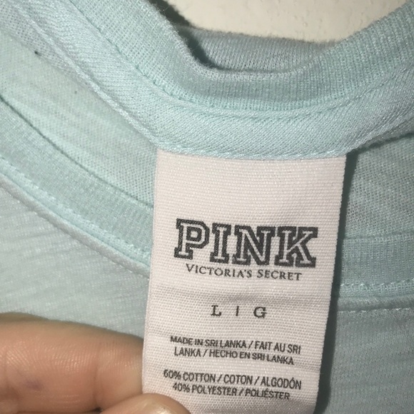 A blue tee with a black and white striped pocket - Picture 3 of 4